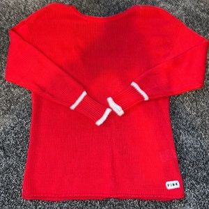 a red PINK sweater with an open back